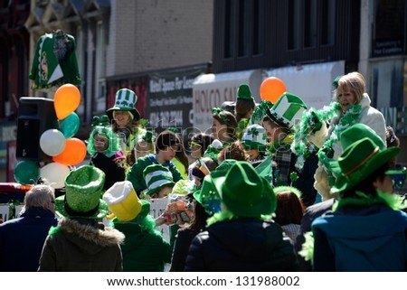 TORONTO - MARCH 17: People dress up on the float truck. Toronto\'s annual St. Patrick\'s Day parade takes place under sunny skies on Sunday afternoon March 17, 2013 in Toronto.