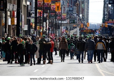 TORONTO - MARCH 17: Huge crowd takes over the street. Toronto\'s annual St. Patrick\'s Day parade takes place under sunny skies on Sunday afternoon March 17, 2013 in Toronto.