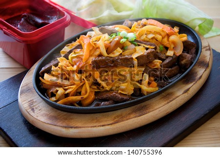 Steaming hot pan fried steak with Korean chilli sauce