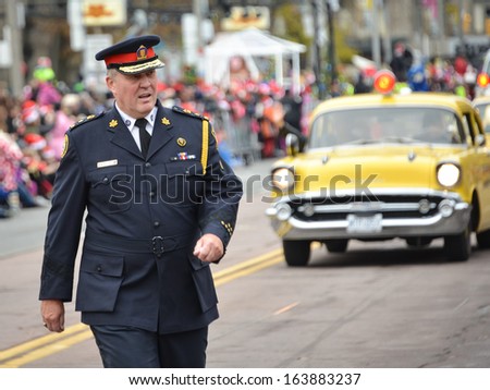 TORONTO - NOVEMBER 17: Police Chief Bill Blair attends 109th Toronto Santa Claus Parade in Toronto, Canada on November 17, 2013.