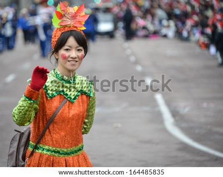 TORONTO - NOVEMBER 17: Girl disguised as a fairy tale character attends the 109th Toronto Santa Claus Parade in Toronto, Canada on November 17, 2013.