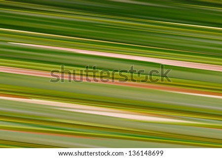 Digital background green. Digital background from multi-colored green and beige stripes. Glitch art.