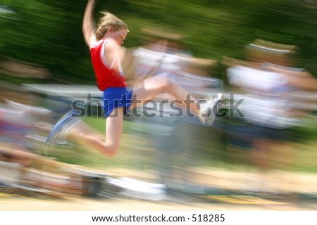 boy jumping at track meet