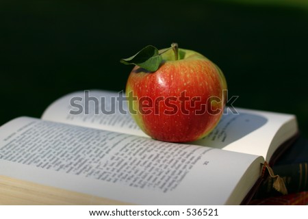 red apple on book, \