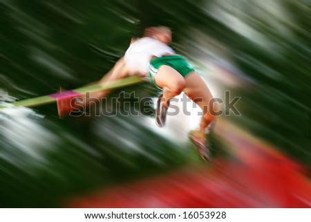 Person jumping over the bar in High Jump (motion blur)