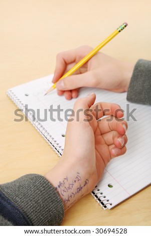 Cheating on a test (focus on the wrist)