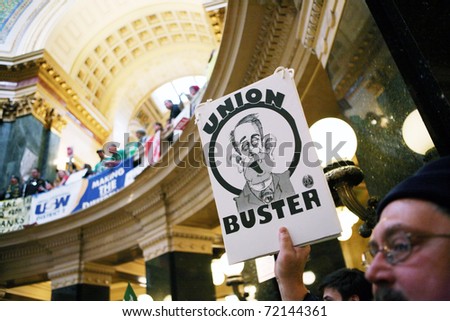 MADISON, WI - FEB 21: Thousands fill the capitol protesting Wisconsin Gov Scott Walker\'s proposal to eliminate collective bargaining rights for public workers on Feb 21, 2011 in Madison Wisconsin.