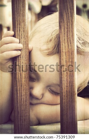 Baby sleeping in a crib, vintage grunge style