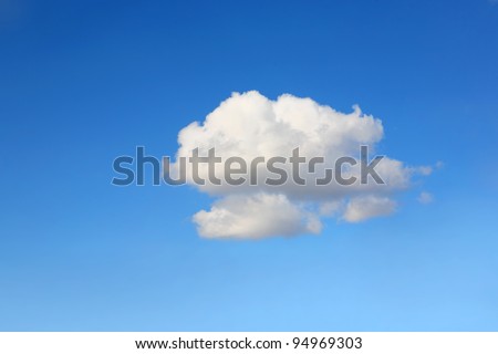 Single cumulus cloud on a blue sky