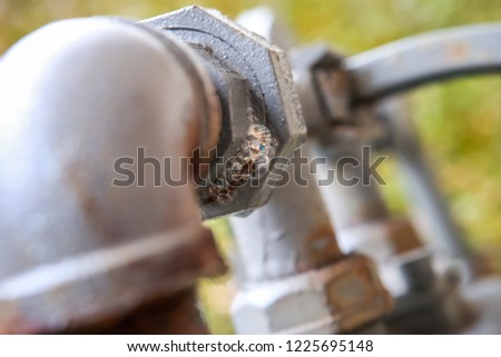 Gas pipe with soap mixture showing bubbles from gas leak