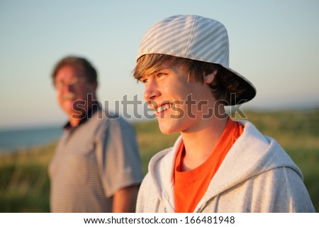 Smiling teen with father