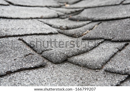 Old composite roof with damage Old composite roof with damage