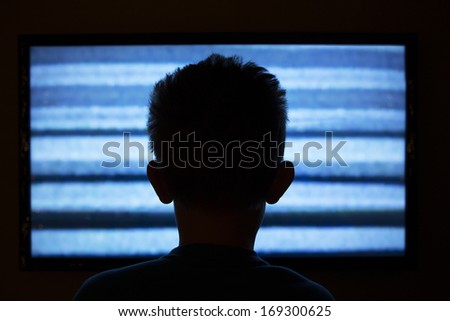Boy Watching Television With Noise