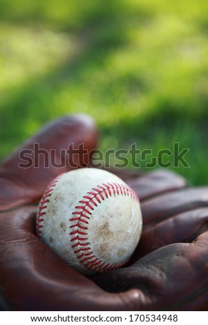 Vintage baseball glove and ball