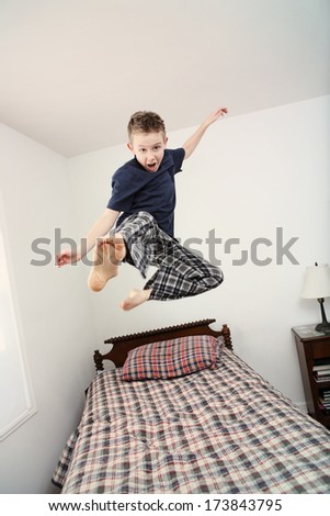 Boy Jumping On Bed (Some Motion Blur)