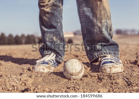 baseball and sneakers in a baseball field