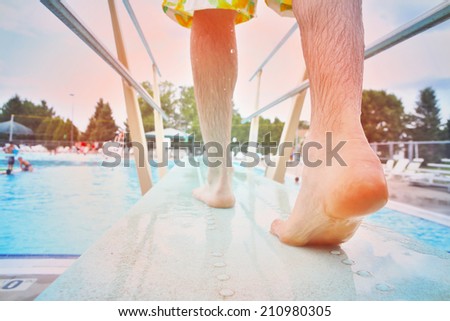 Feet on a diving board