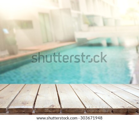 Wood Table Top Of Background And Pool