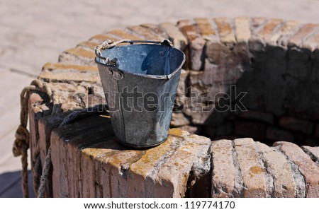 A water well with an old bucket in Samarkand, Uzbekistan