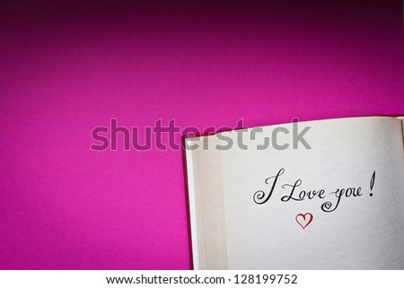 I love you! vintage style words in the open book with pink background