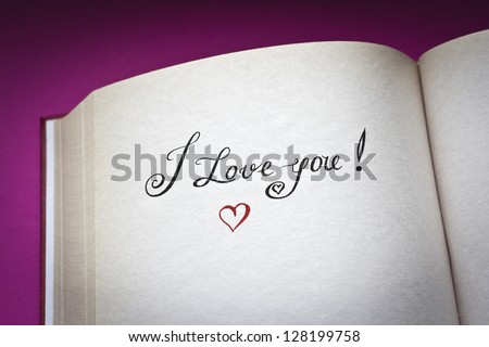 I love you! vintage style words in the open book with pink background