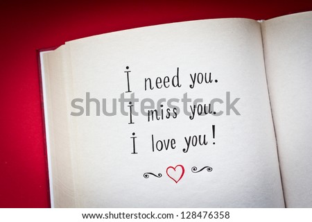 Hand drawn words I need you, I miss you, I love you in the open book with red background