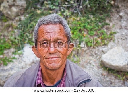 Mana village, India - October 1, 2014: A poor man with sad face from small village in Himalayas. Idea - Poverty concept.