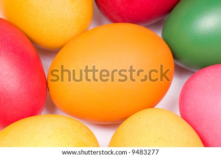 Colorful Easter eggs in red, yellow, orange and green color. Detail.