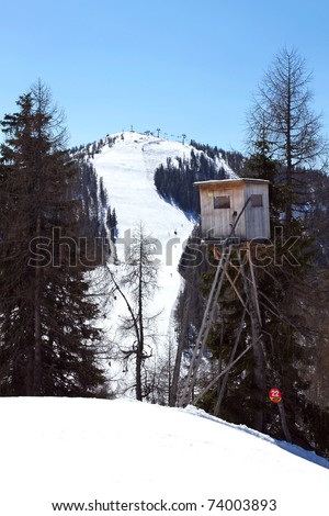 screened shooting stand in the austia alps