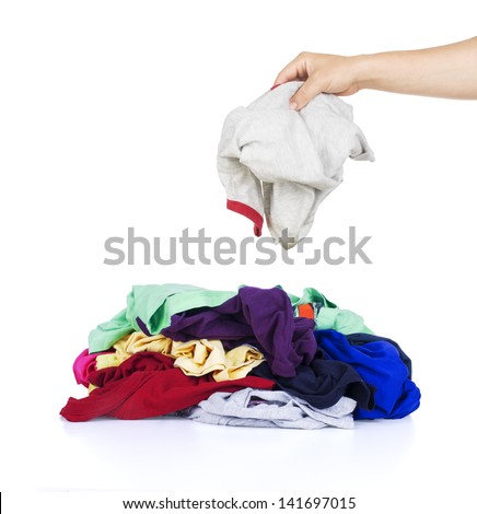 Big heap of colorful clothes isolated on white background