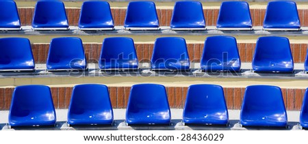 Many blue stadium plastic seats