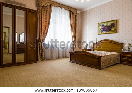 Bedroom classicism brown interior with paint on the wall
