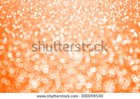 Abstract orange glitter sparkle bokeh background Halloween Autumn or holiday party invite