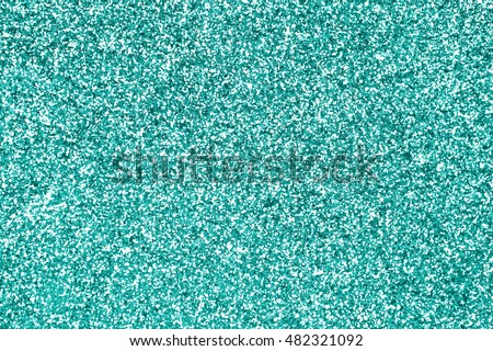 Teal green or turquoise and aqua glitter sparkle background texture or mint color party invite