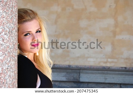 Portrait of a young beautiful woman with a sad face expression