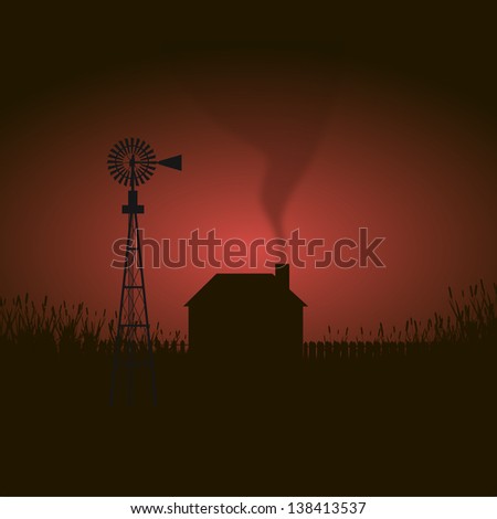 Windmill and House silhouette on cornfield