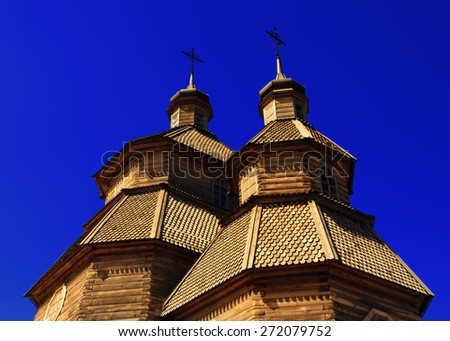 Top of the domes of wooden cossack church Covers of the Blessed Virgin on the island Hortitsa in Zaporozhye, Ukraine