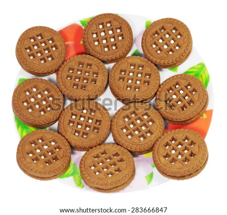 Round cookies on the plate isolated on white