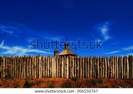 View on the top of a wooden cossack church Covers of the Blessed Virgin located behind the palisade of logs, on the island of Hortitsa, Ukraine