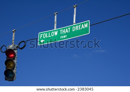 A street sign tells you to Follow That Dream.
