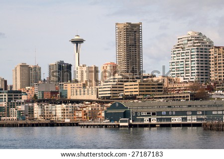 Pier 59 waterfront area of Seattle, including downtown and the Space Needle, taken from the ferry in the Puget Sound.
