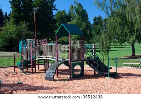 A playground set contains slides, jungle gyms, bridges and a climbing wall.