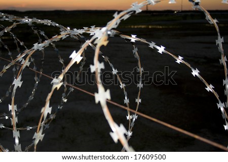 Barbed fence in the dark night