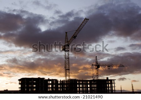 Night scene on a building area . Elevating crane