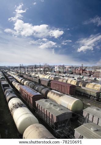 Railroad cars on a railway station. Cargo transportation. Work of industry. Urban scene. Train
