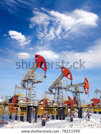 White clouds above oil field. Oil and gas industry