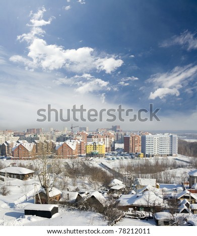 Cityscape of old and new district. Winter town with frozen street