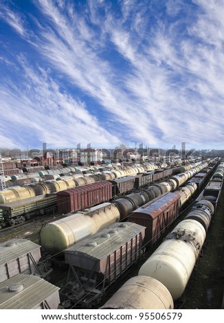 Railroad cars on a railway station. Cargo transportation. Work of industry. Urban scene