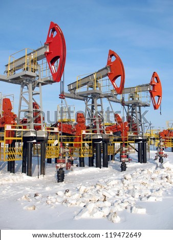 Oil and gas industry. Work of oil pump jack on a oil field. Extraction of oil. Oil industry of West Siberia