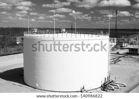 Oil industry and gas industry. Work of refinery petrochemical plant. Oil reservoir and storage tank of mineral oil. |Black and white photo
